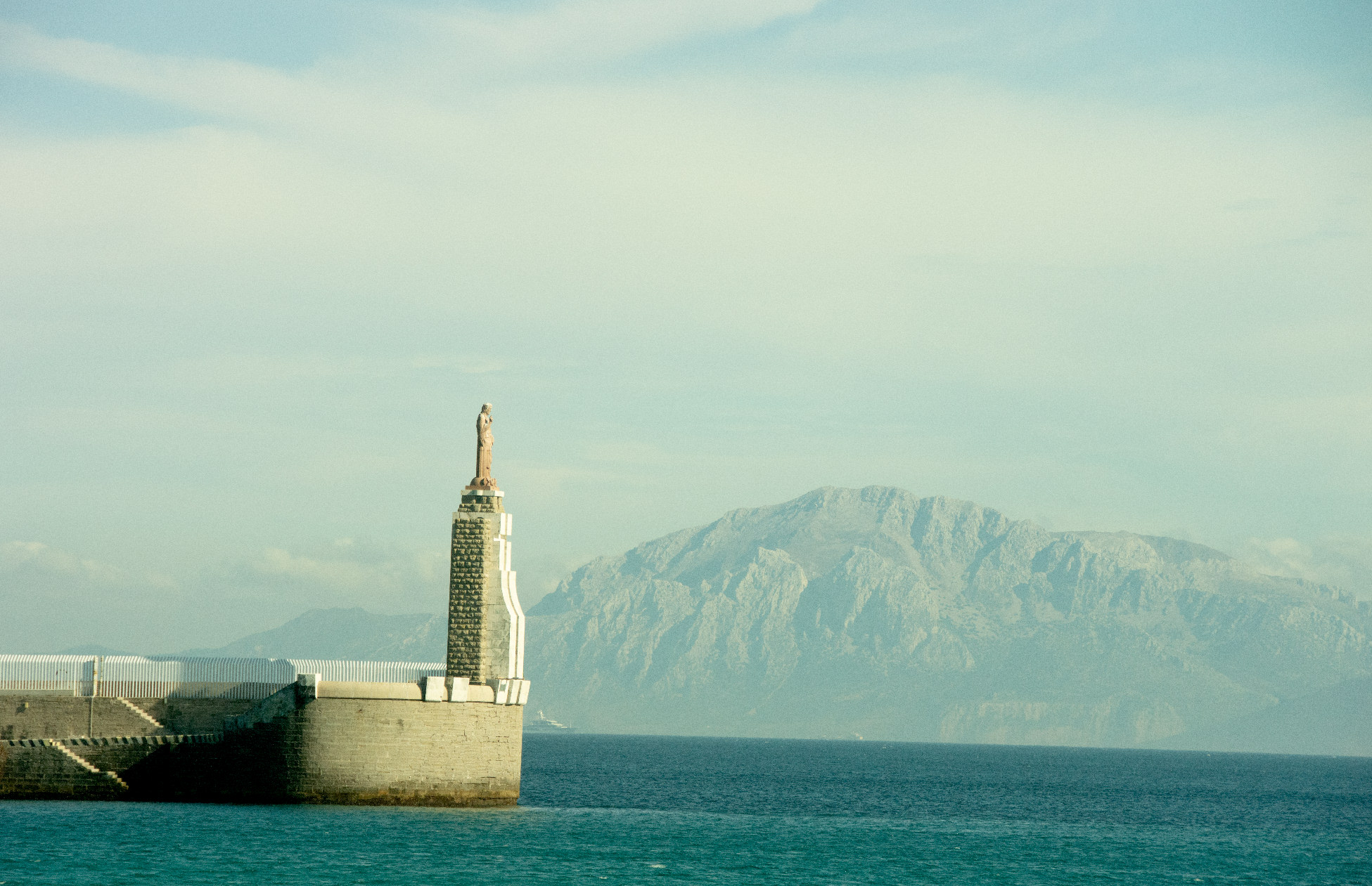 statue overlooking ocean in tarifa spain